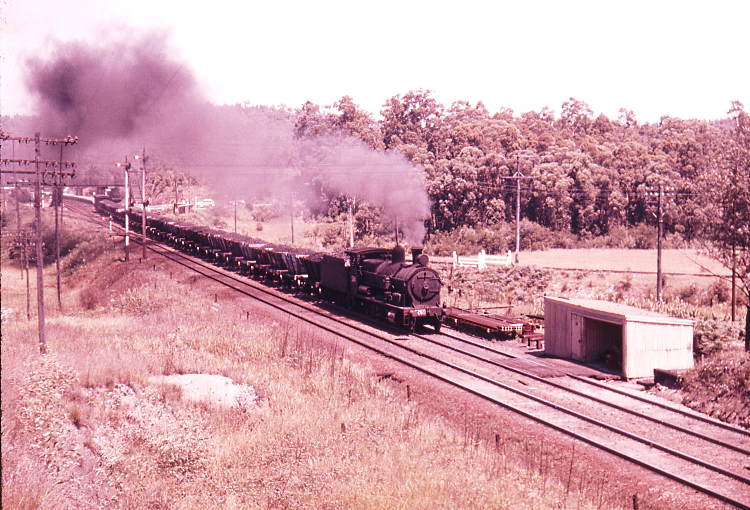 Down loaded coal train at Fassifern with standard goods engines on the front and rear